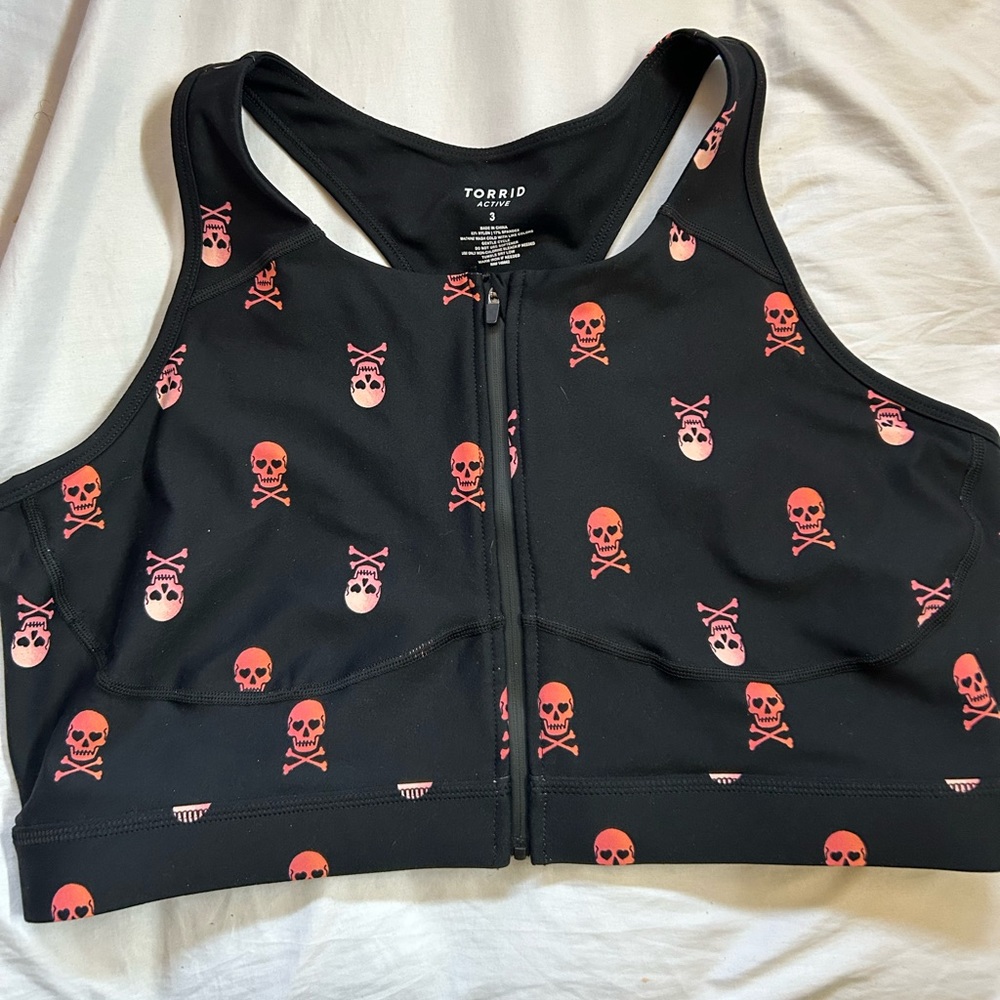 Torrid skulls zip front sports bra